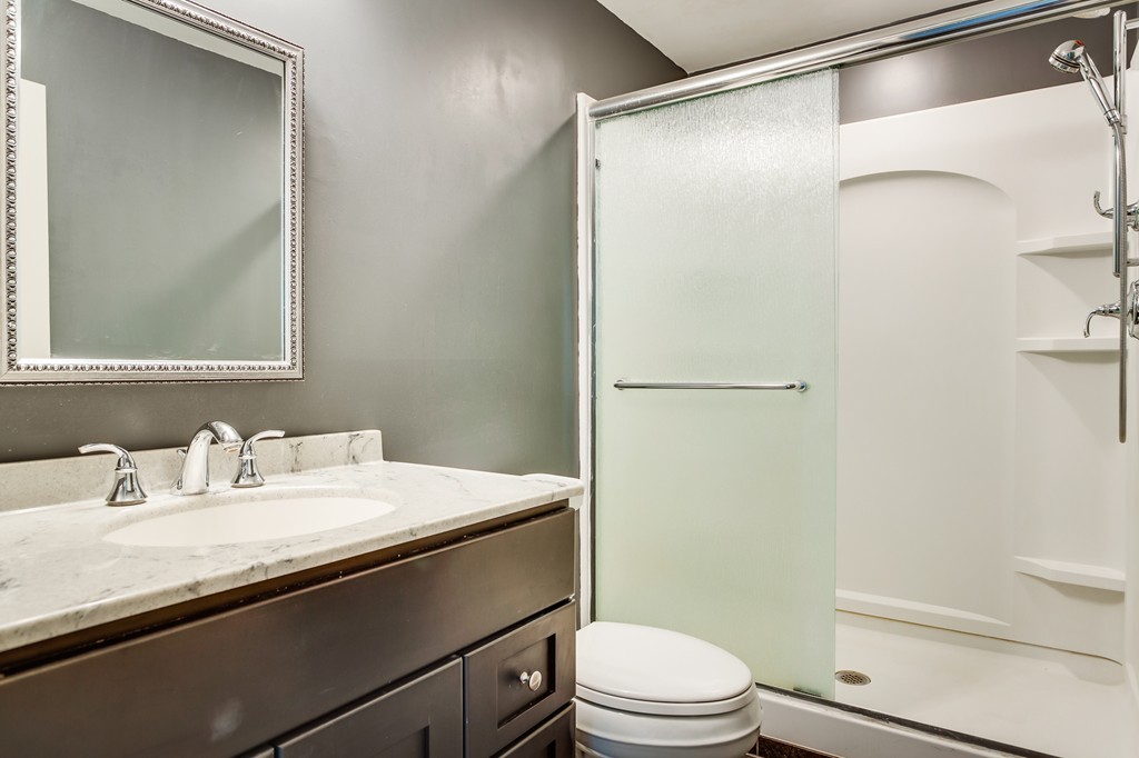 233 Middle Road Newbury, MA 01922 - Photo 27 of 30 a bathroom with a sink a toilet and shower