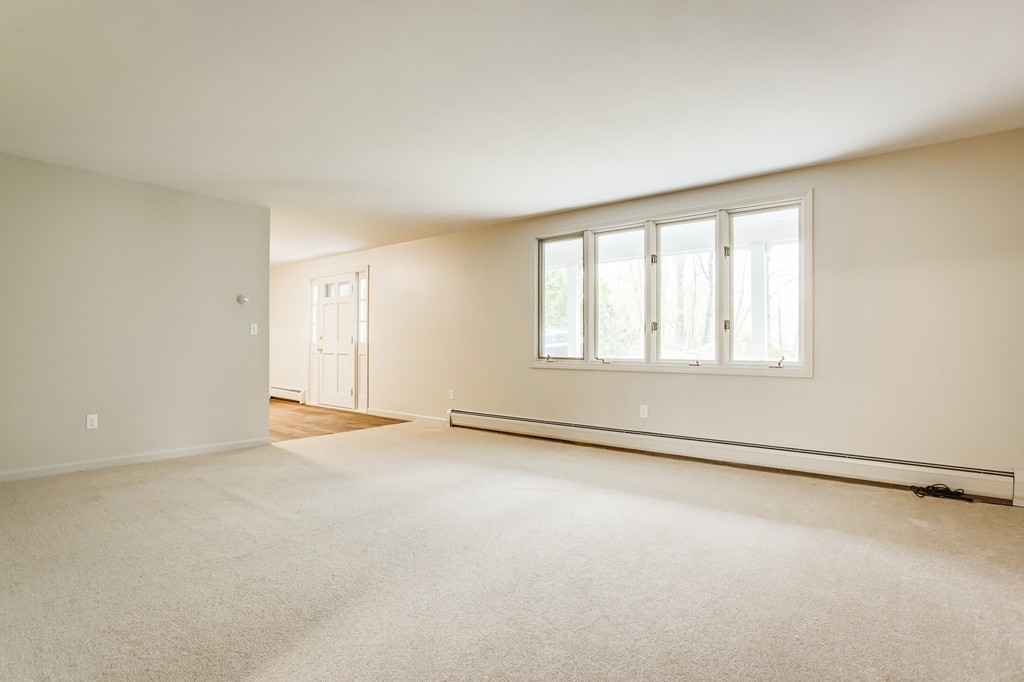 233 Middle Road Newbury, MA 01922 - Photo 4 of 30 an empty room with windows