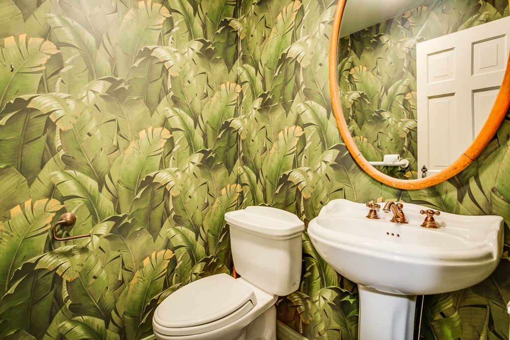 233 Middle Road Newbury, MA 01922 - Photo 5 of 30 a bathroom with a sink a toilet and a mirror