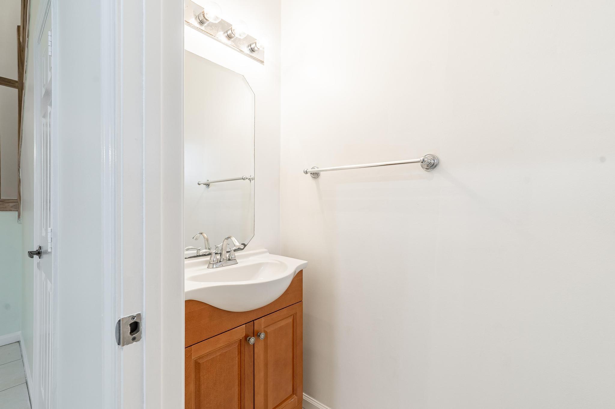 8271 Vía Serena Boca Raton, FL 33433 - Photo 13 of 33 a bathroom with a sink a mirror and a shower