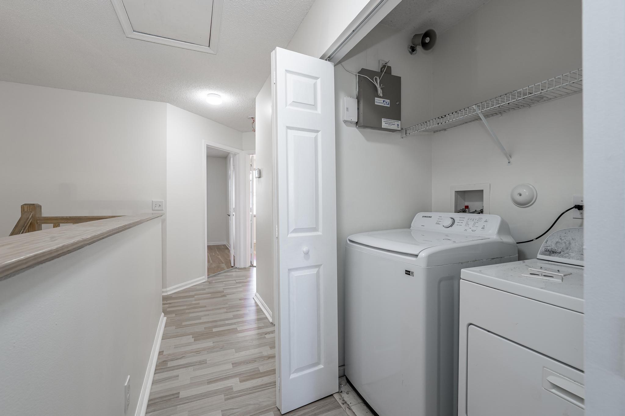 8271 Vía Serena Boca Raton, FL 33433 - Photo 14 of 33 a view of storage and utility room with washer and dryer