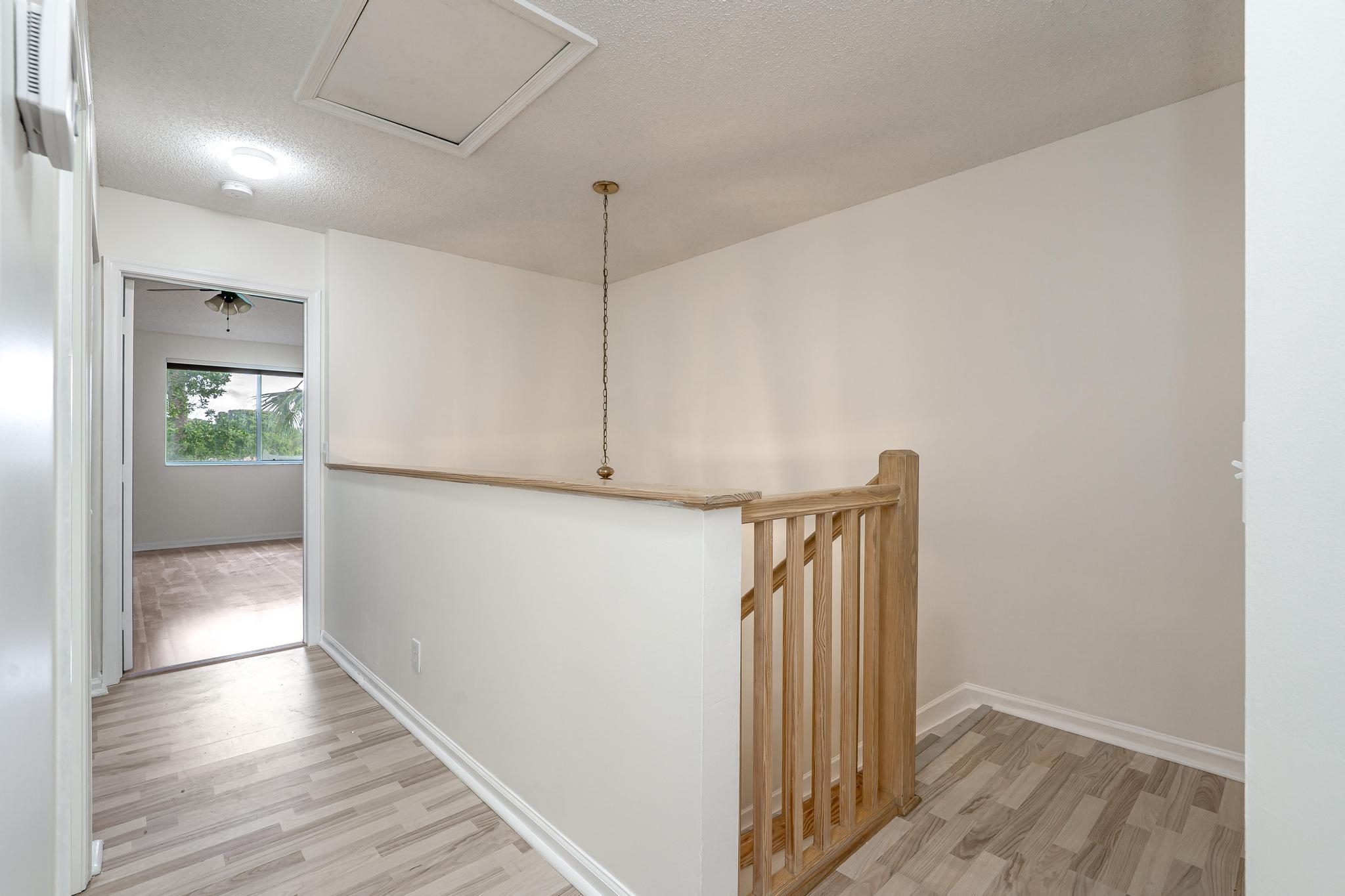 8271 Vía Serena Boca Raton, FL 33433 - Photo 15 of 33 a view of hallway with wooden floor