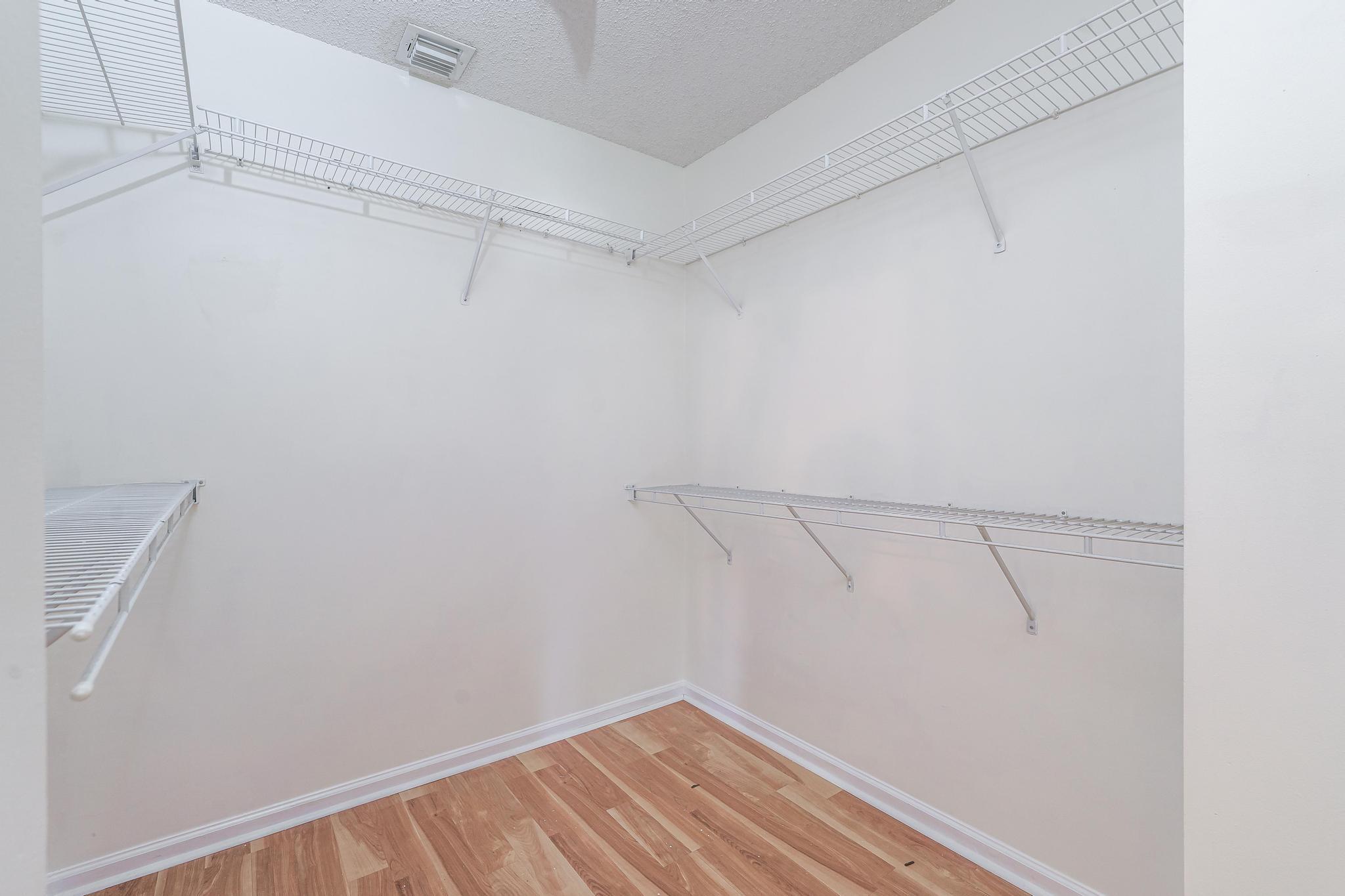 8271 Vía Serena Boca Raton, FL 33433 - Photo 20 of 33 a view of a room with racks on the wall