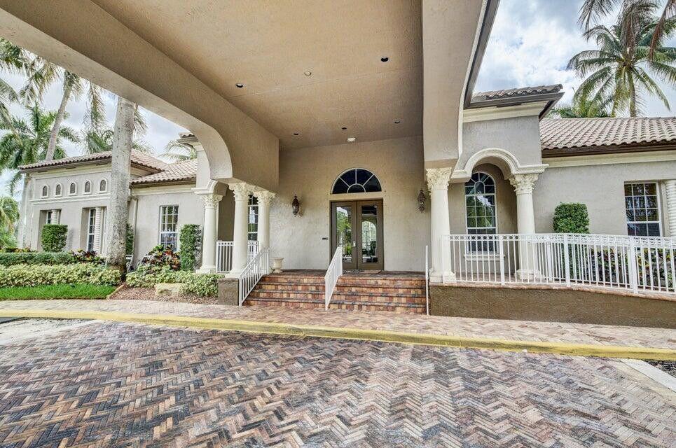 8271 Vía Serena Boca Raton, FL 33433 - Photo 27 of 33 a front view of a house with garden
