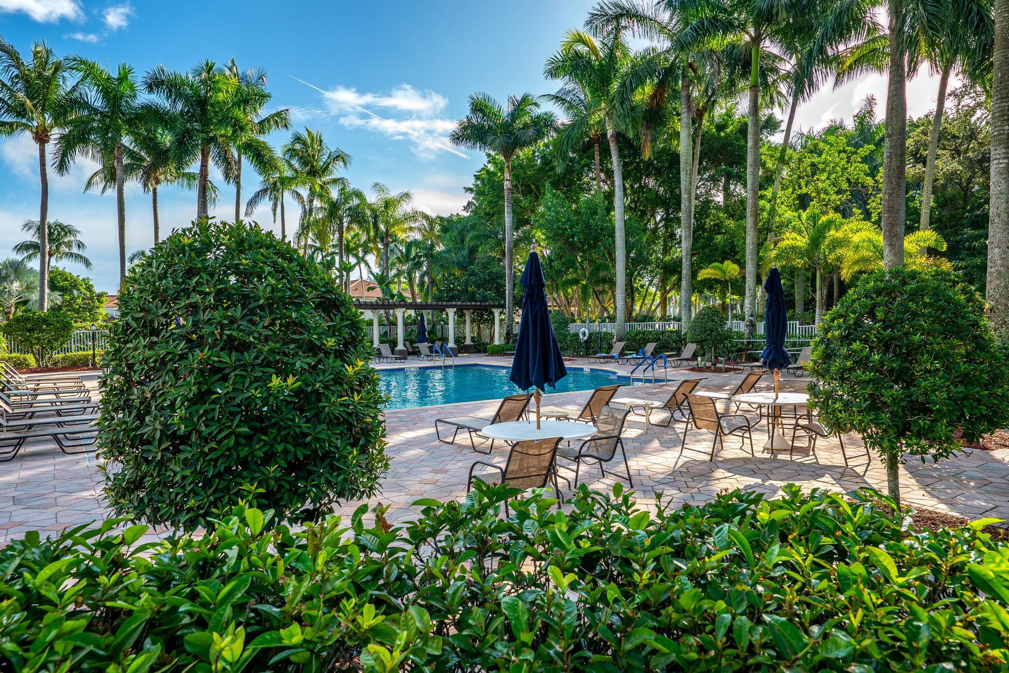 8271 Vía Serena Boca Raton, FL 33433 - Photo 30 of 33 a view of a backyard with sitting area