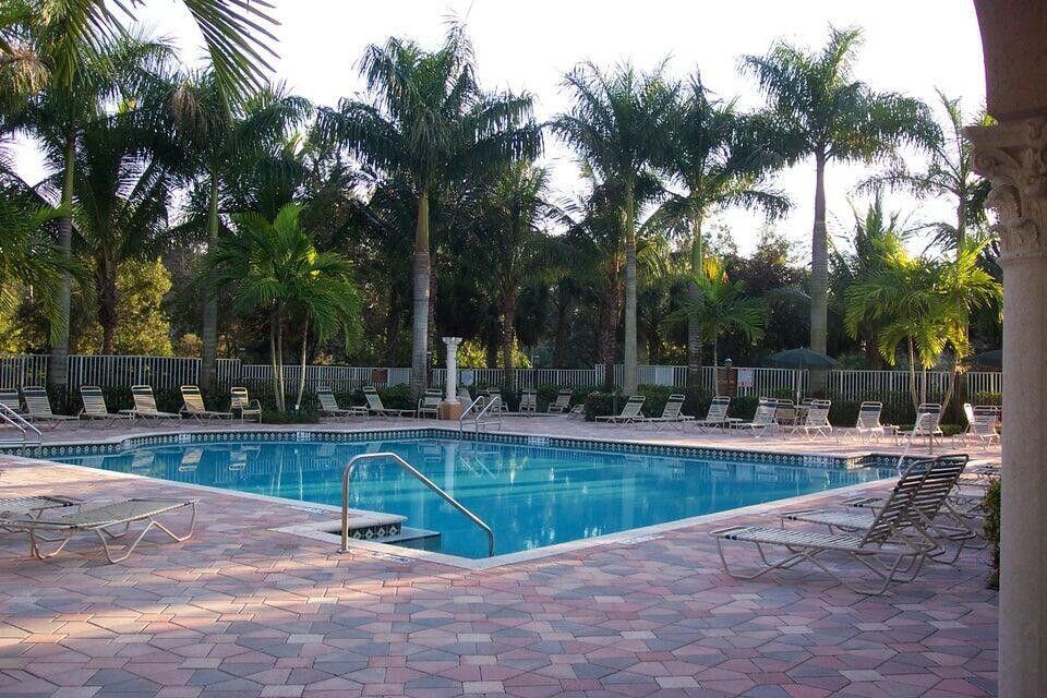 8271 Vía Serena Boca Raton, FL 33433 - Photo 31 of 33 a view of a swimming pool with a sitting area