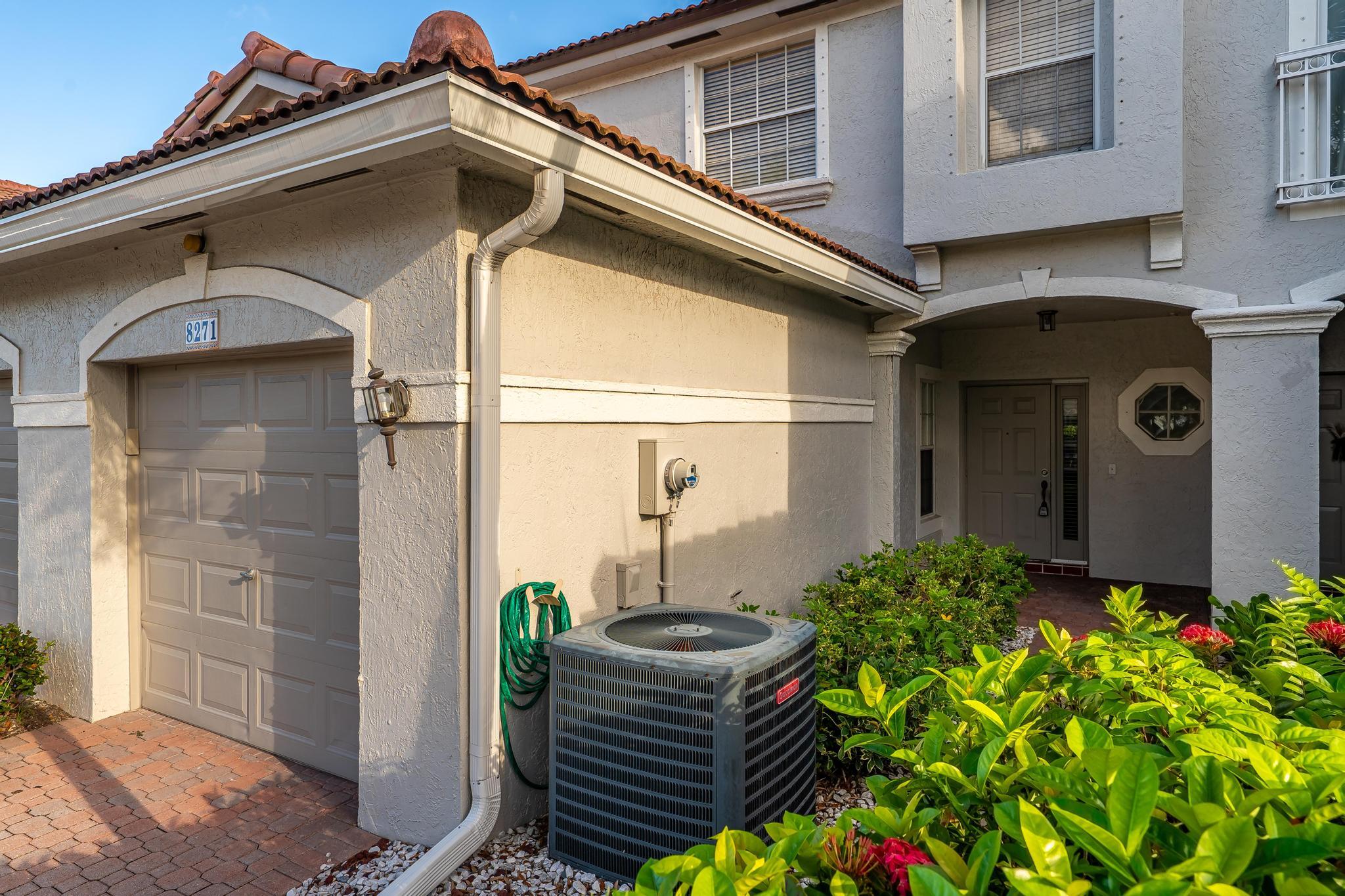 8271 Vía Serena Boca Raton, FL 33433 - Photo 4 of 33 a front view of a house with outdoor seating