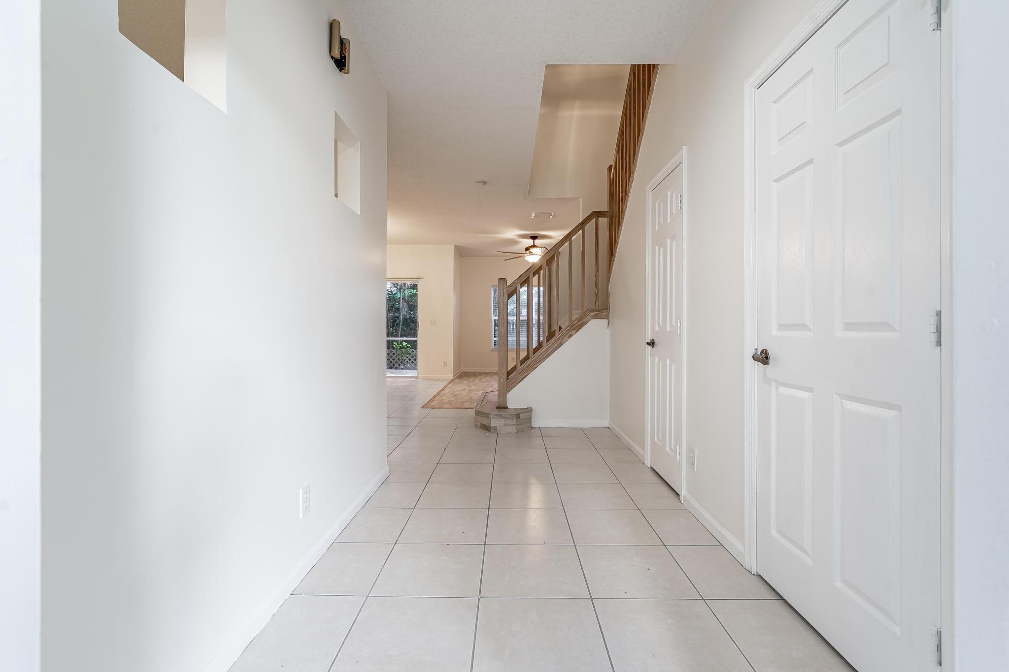 8271 Vía Serena Boca Raton, FL 33433 - Photo 5 of 33 a view of an entryway with stairs