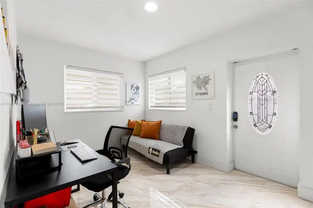 a living room with furniture and a window