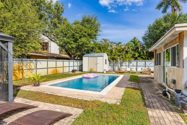 a view of a house with swimming pool
