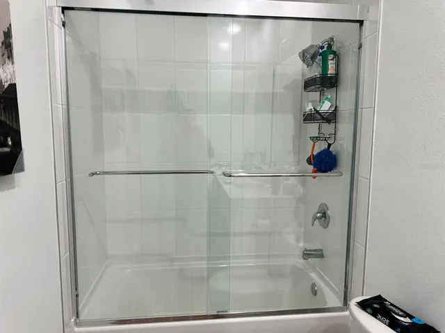 a white house that has a tree in front of it