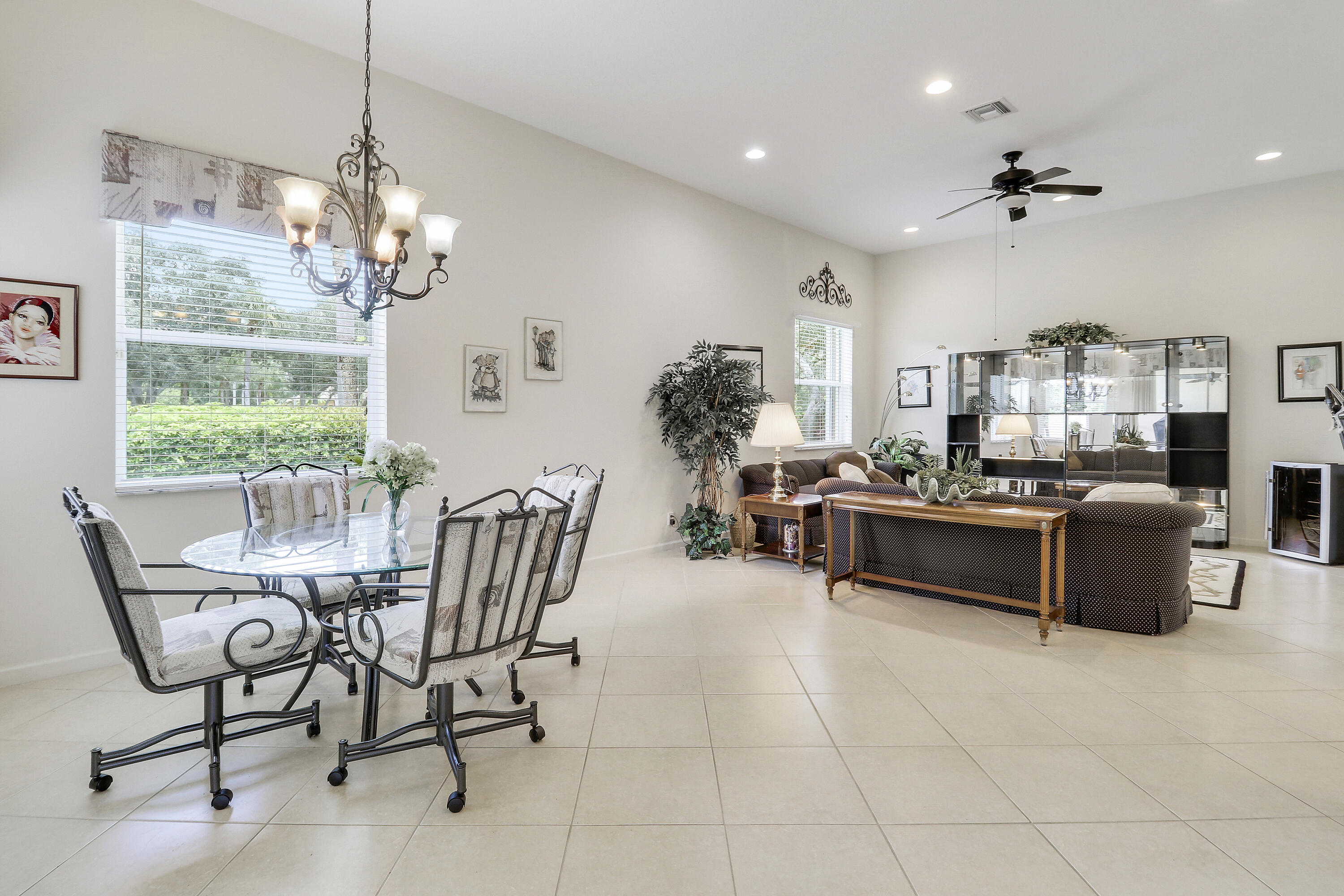 6565 Garde Road Boynton Beach, FL 33472 - Photo 14 of 54 a living room with furniture and a chandelier