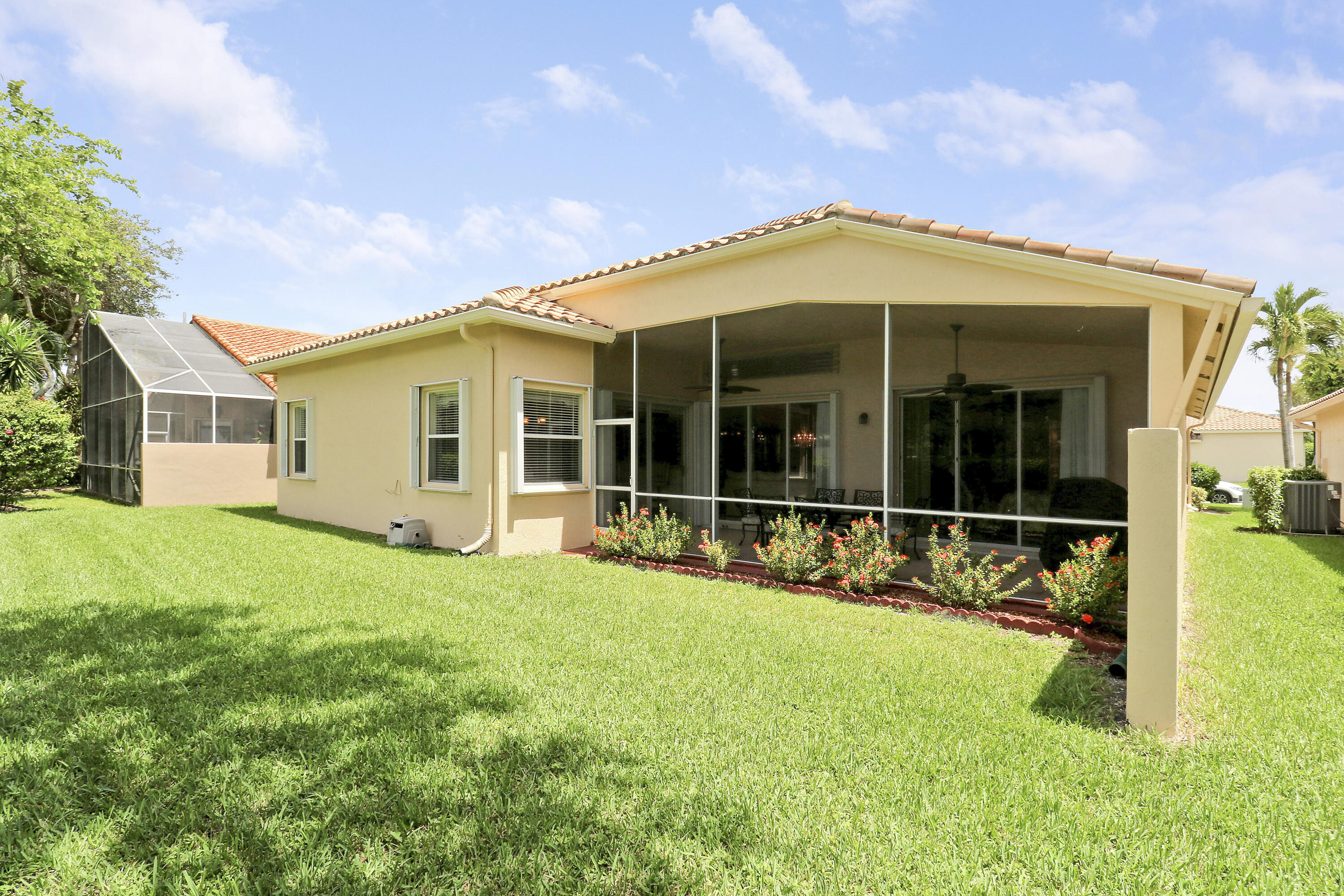6565 Garde Road Boynton Beach, FL 33472 - Photo 23 of 54 a view of a house with backyard porch and garden