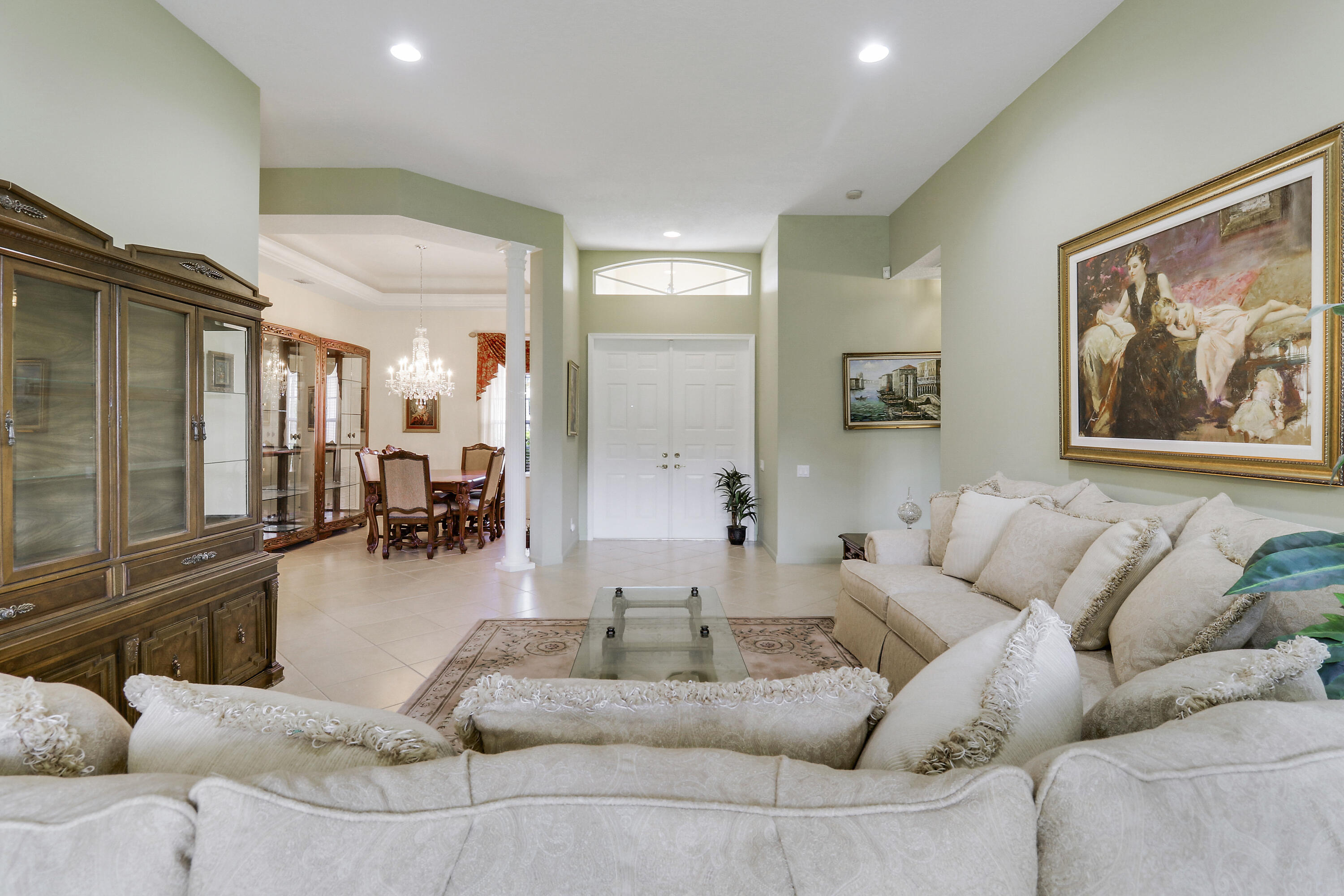 6565 Garde Road Boynton Beach, FL 33472 - Photo 26 of 54 a living room with furniture and a large mirror