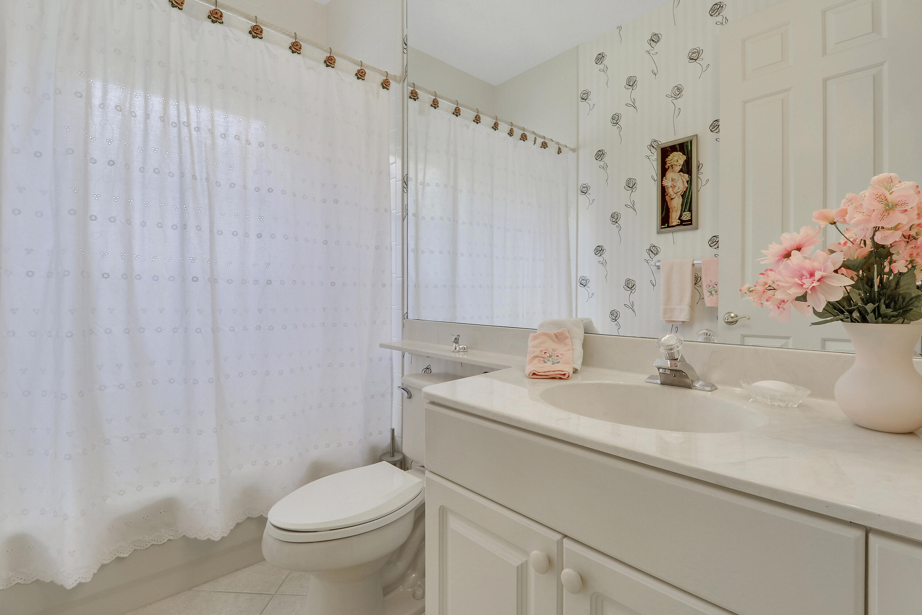 6565 Garde Road Boynton Beach, FL 33472 - Photo 36 of 54 a bathroom with a sink toilet and shower