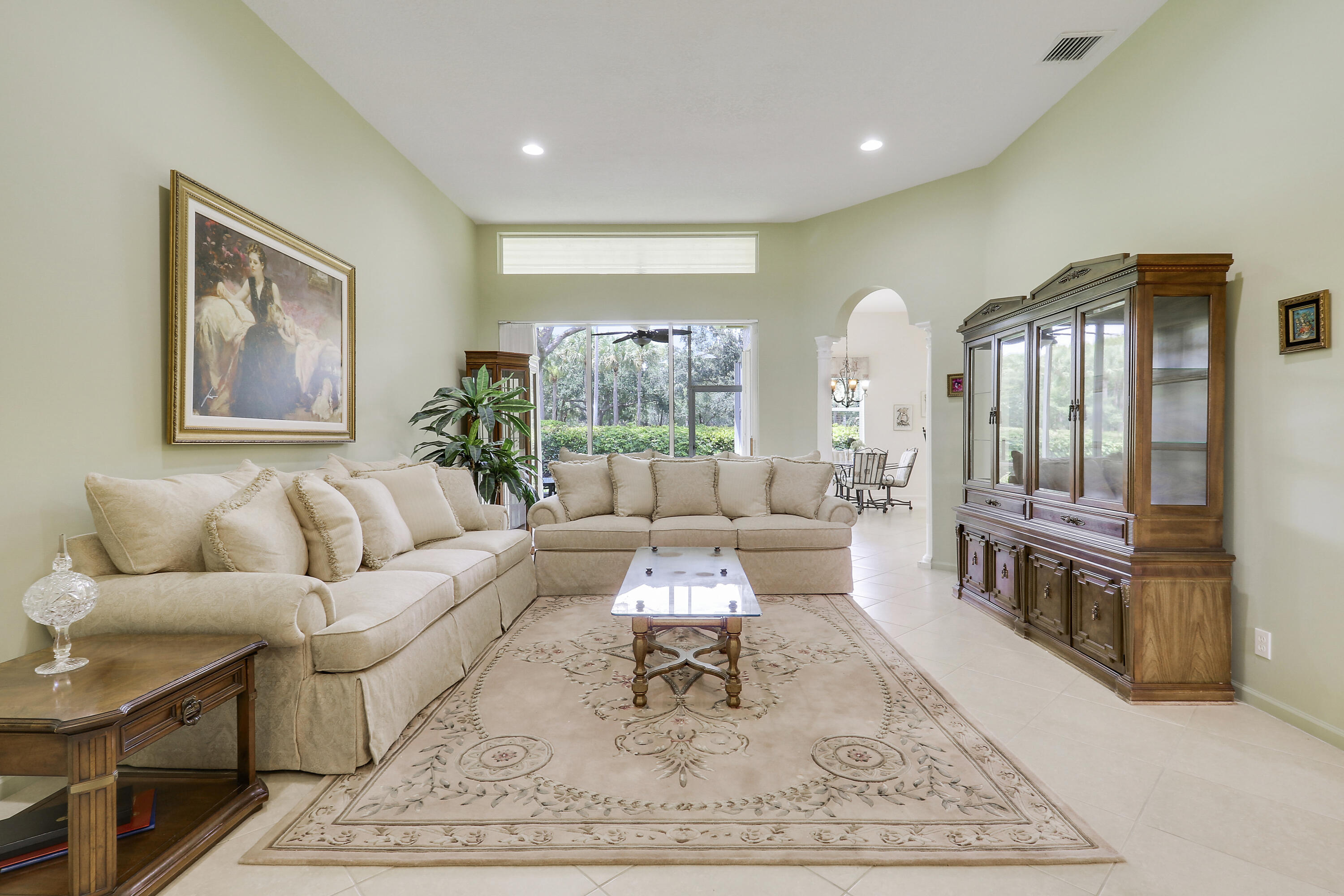6565 Garde Road Boynton Beach, FL 33472 - Photo 4 of 54 a living room with furniture and a wooden floor