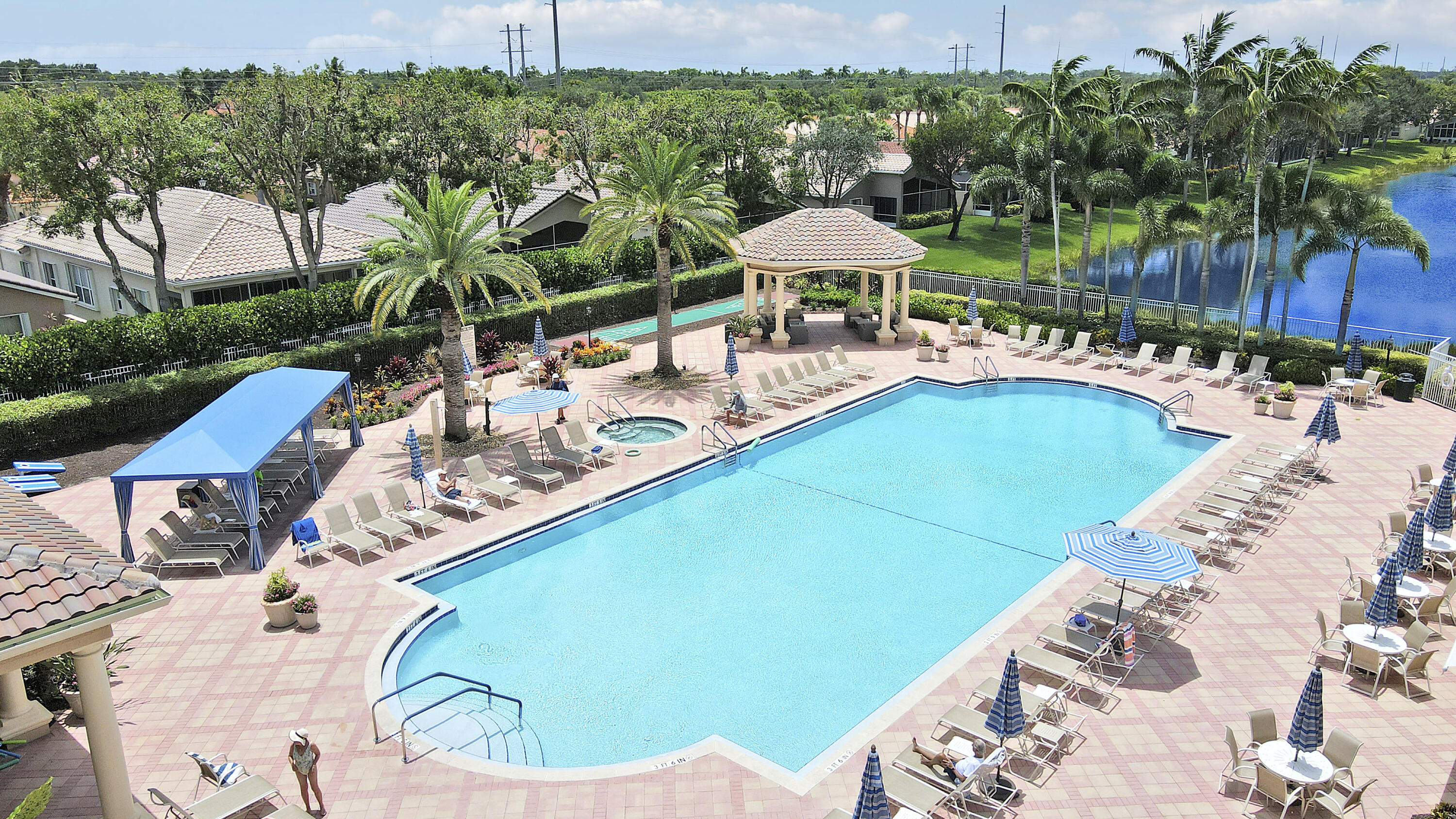 6565 Garde Road Boynton Beach, FL 33472 - Photo 44 of 54 a view of a swimming pool with a patio