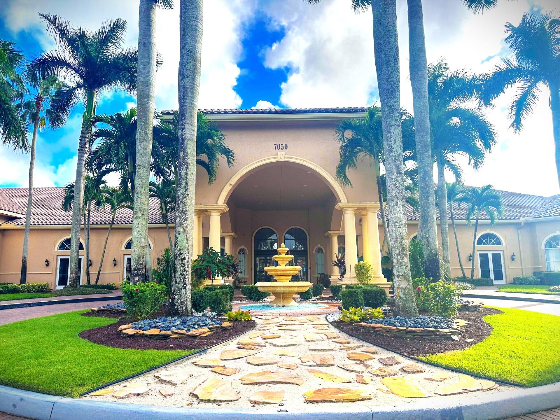 6565 Garde Road Boynton Beach, FL 33472 - Photo 46 of 54 a front view of a house with swimming pool