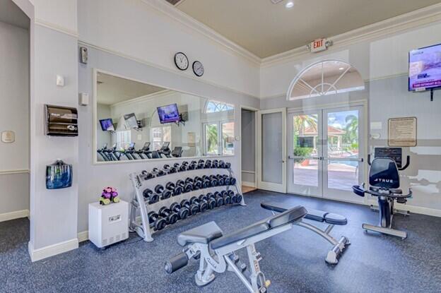 6565 Garde Road Boynton Beach, FL 33472 - Photo 53 of 54 a bedroom with furniture and a chandelier