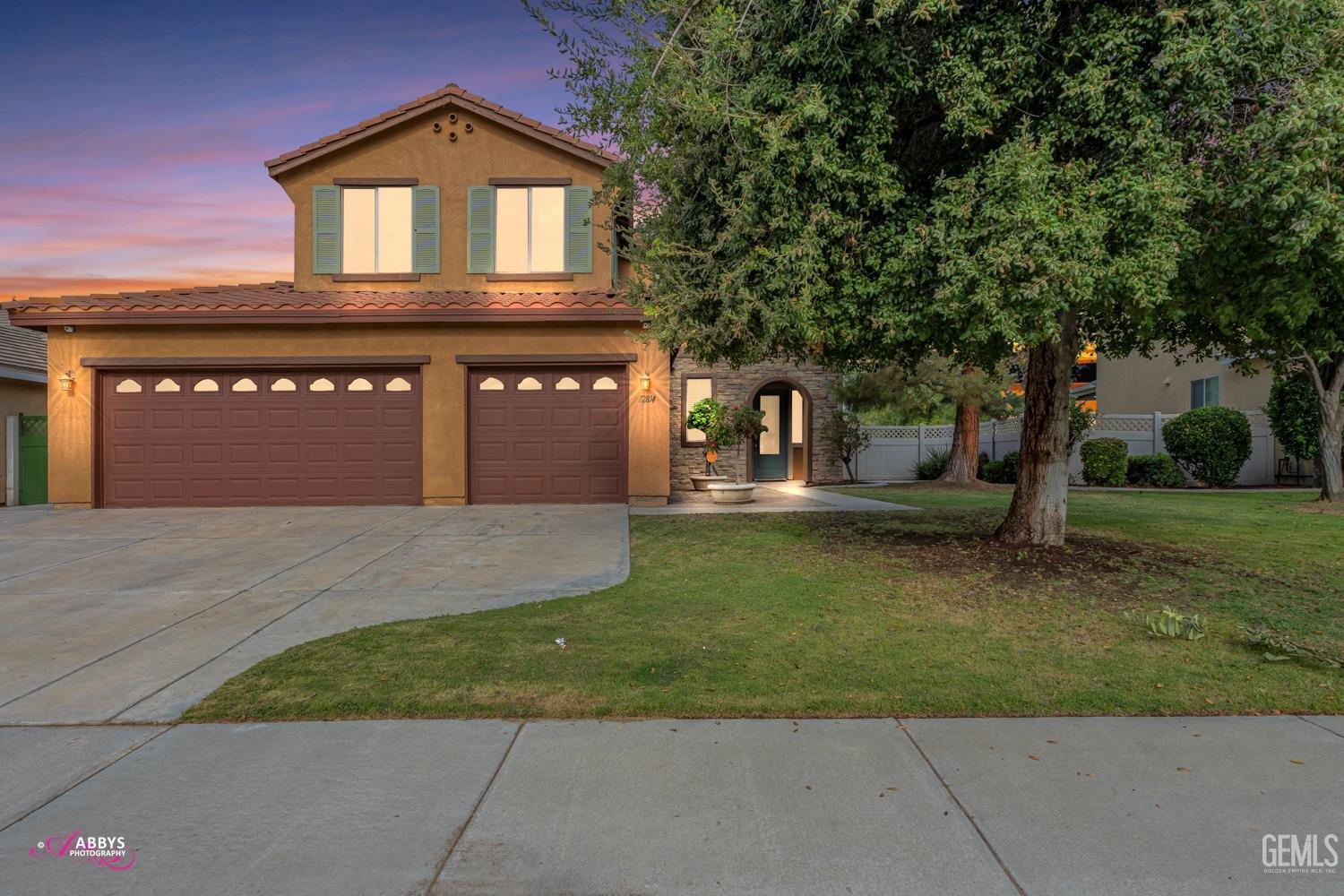 Undisclosed Address Bakersfield, CA 93312 - Photo 1 of 44 a front view of a house with garden