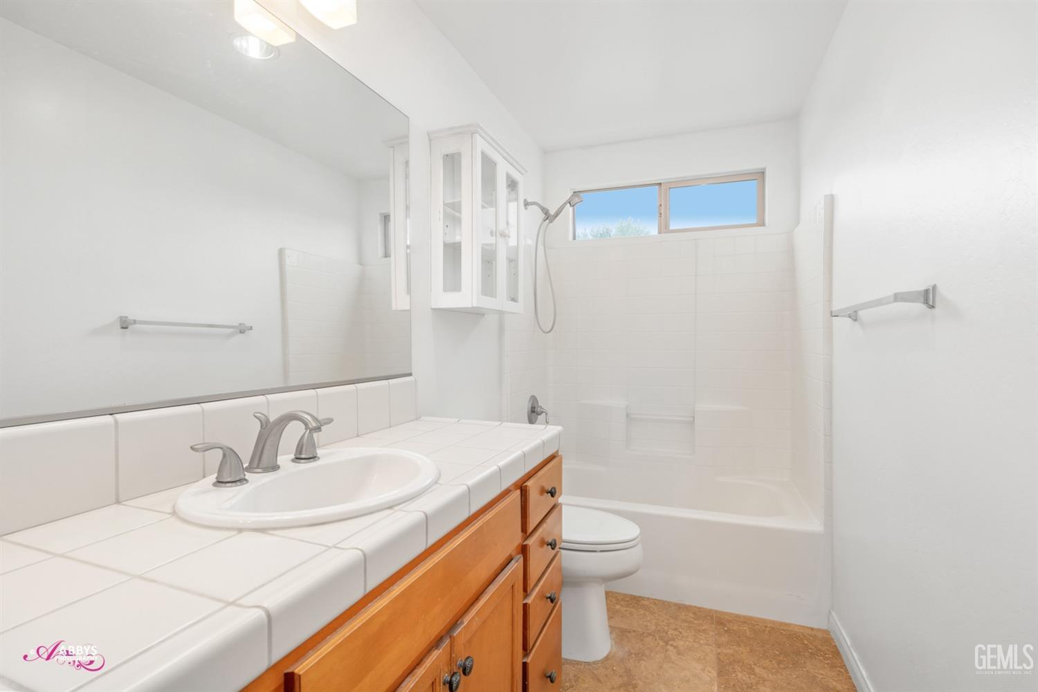 Undisclosed Address Bakersfield, CA 93312 - Photo 11 of 44 a bathroom with a sink toilet and shower