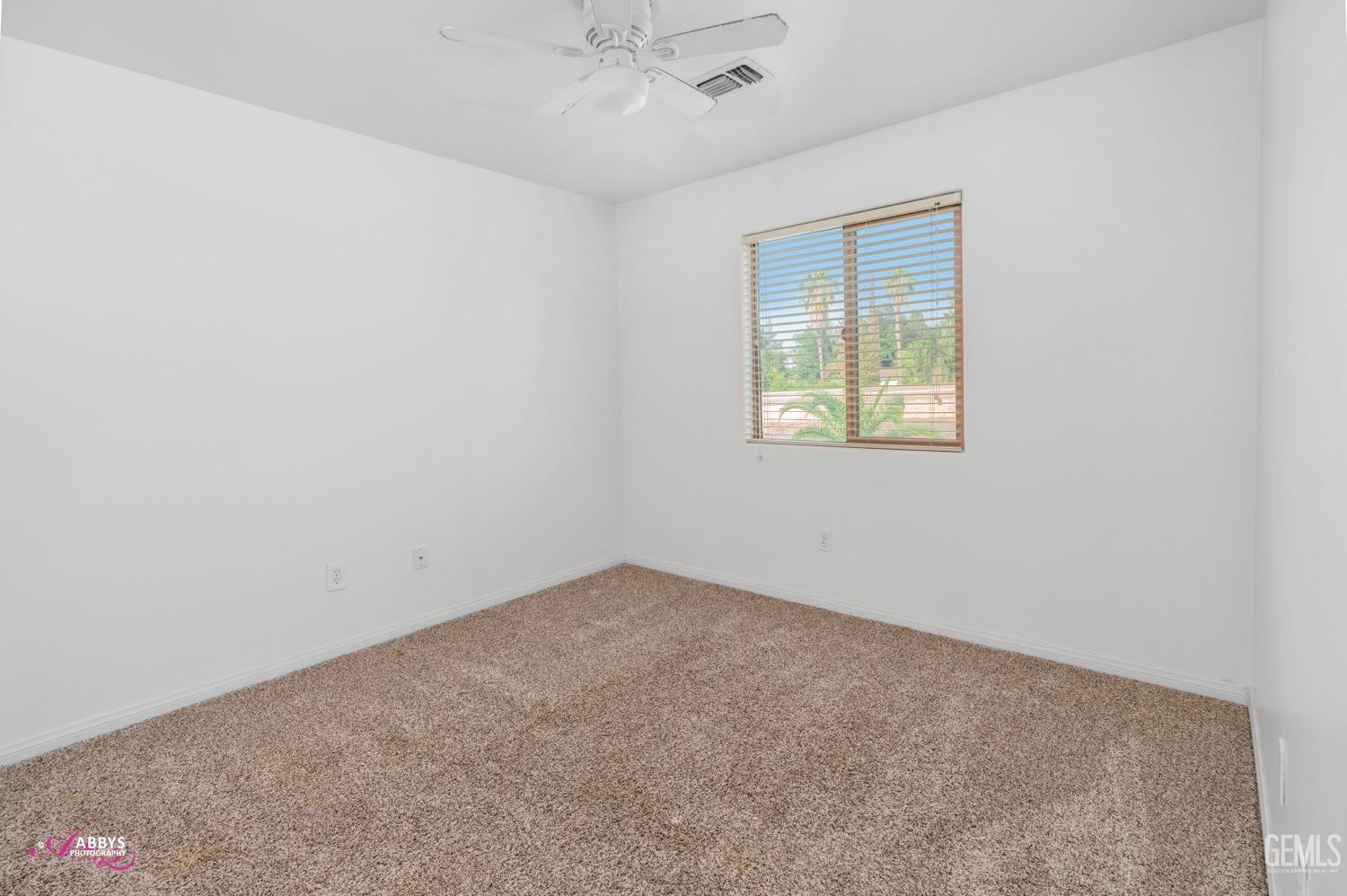 Undisclosed Address Bakersfield, CA 93312 - Photo 12 of 44 an empty room with a window