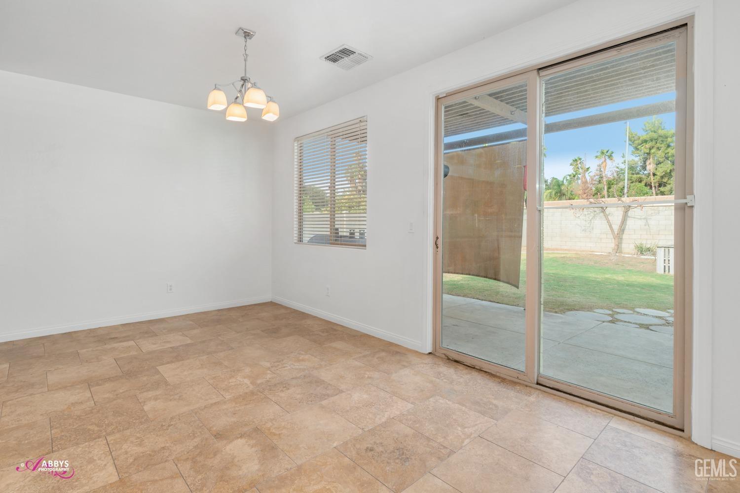 Undisclosed Address Bakersfield, CA 93312 - Photo 29 of 44 a view of an empty room with a window