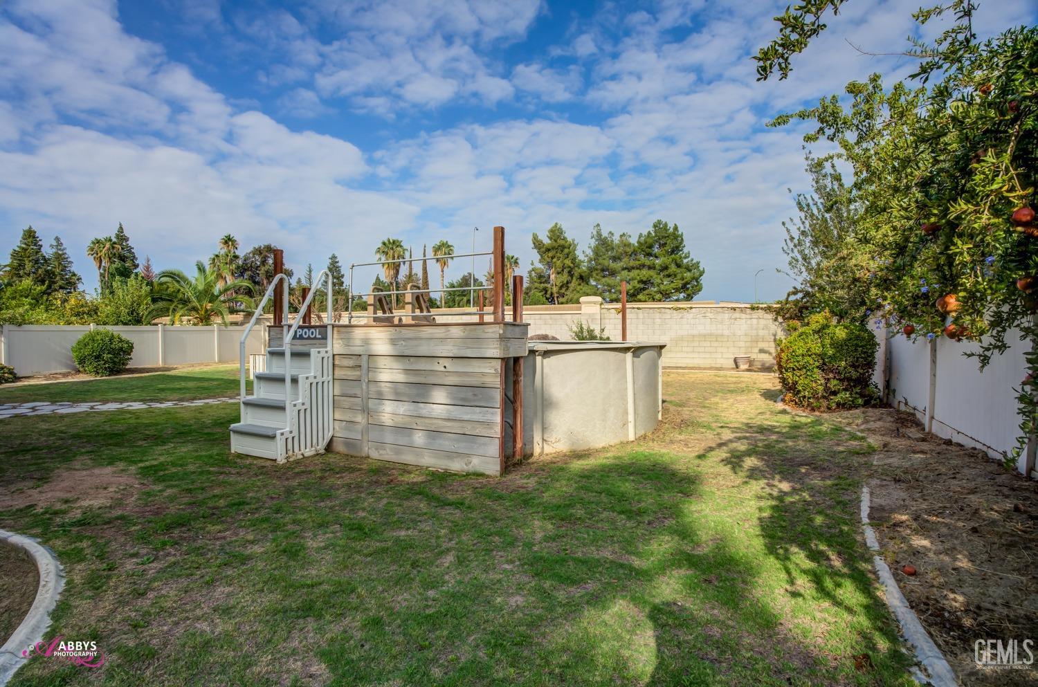 Undisclosed Address Bakersfield, CA 93312 - Photo 3 of 44 a view of a garden with an outdoor seating