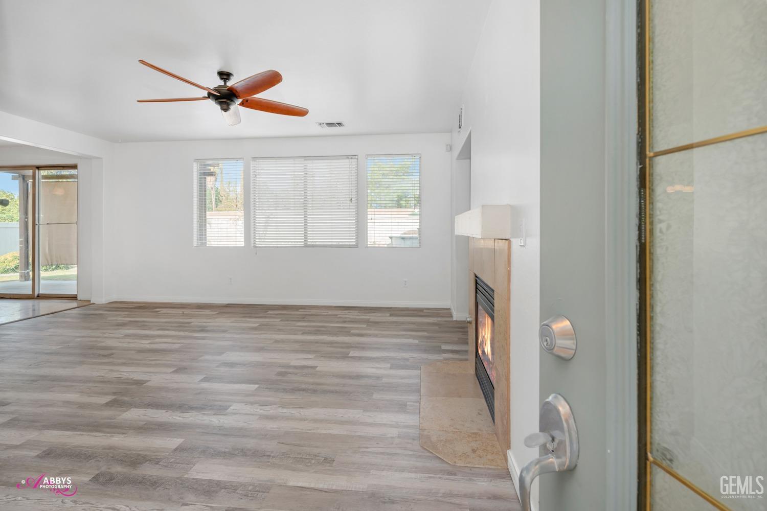 Undisclosed Address Bakersfield, CA 93312 - Photo 35 of 44 a view of empty room with wooden floor and fan