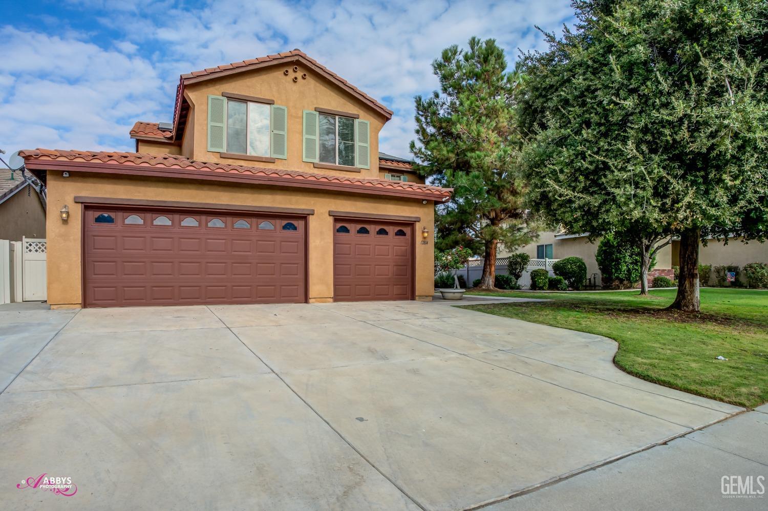 Undisclosed Address Bakersfield, CA 93312 - Photo 38 of 44 a front view of a house with garden