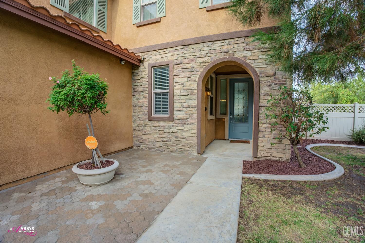 Undisclosed Address Bakersfield, CA 93312 - Photo 39 of 44 a front view of a house with garden
