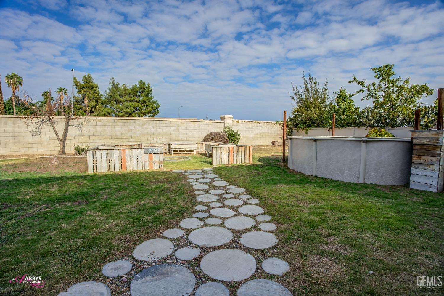 Undisclosed Address Bakersfield, CA 93312 - Photo 6 of 44 a view of a backyard
