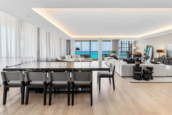 a dining room with furniture and wooden floor