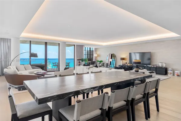 a view of a dining room with furniture window and outside view