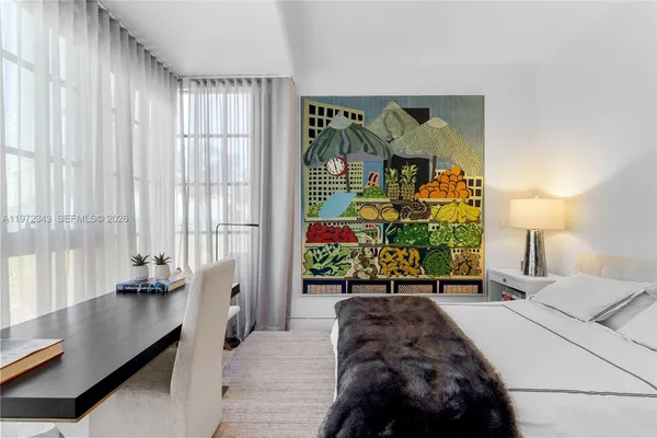 a living room with furniture and a mirror