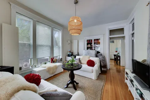 a living room with furniture fireplace and flat screen tv