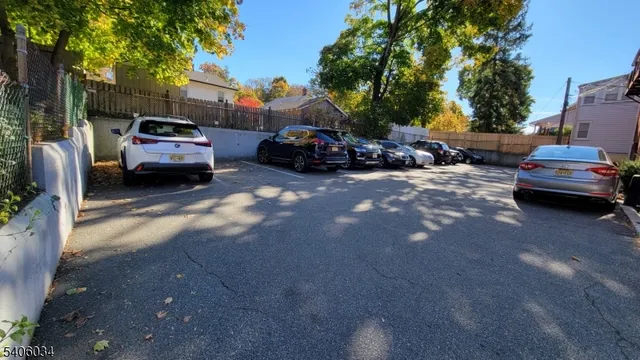 a view of a car parked in front of a house