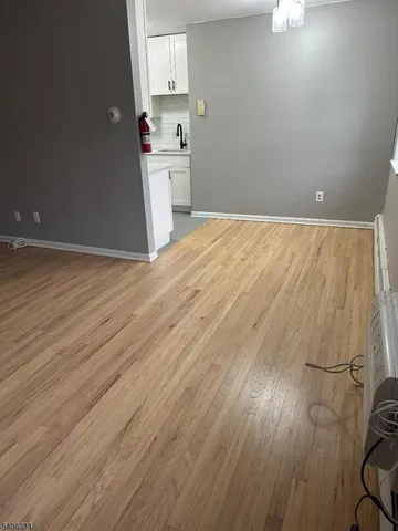 a view of a kitchen with wooden floor
