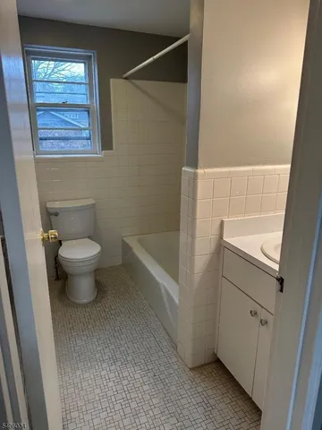 a bathroom with a toilet and a sink