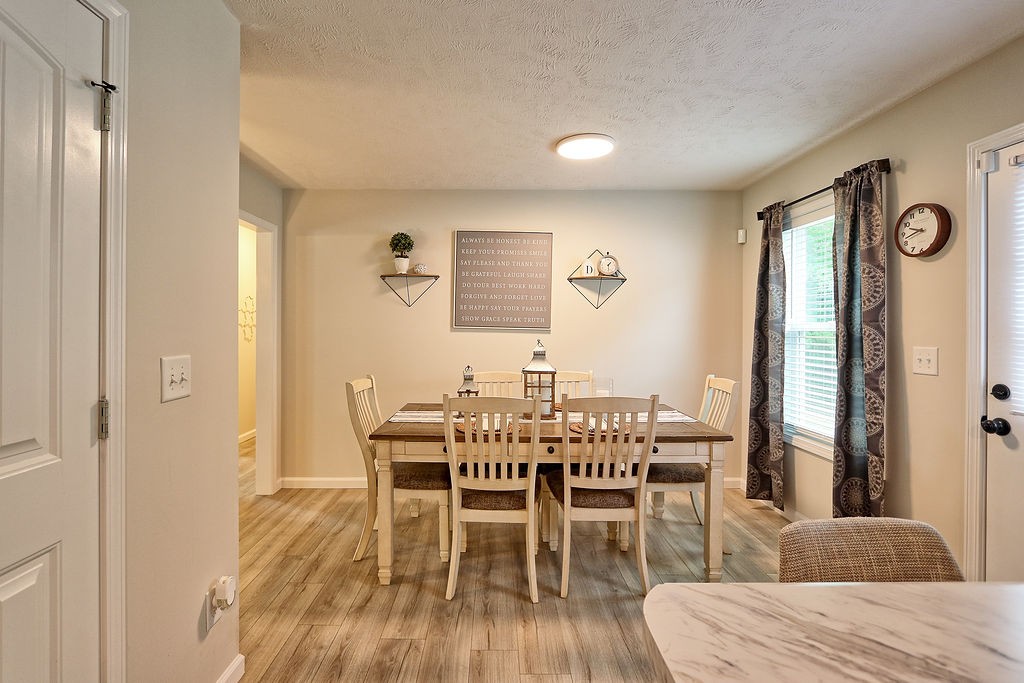 111 Heritage Hills Lane Hohenwald, TN 38462 - Photo 12 of 48 a view of a dining room with furniture and window