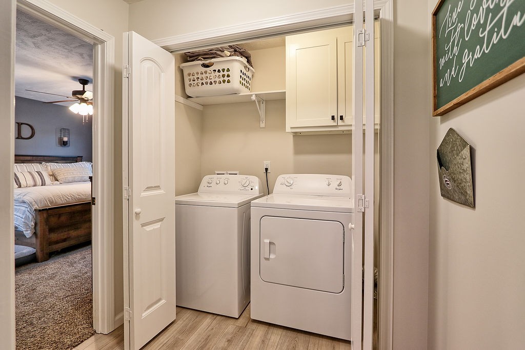 111 Heritage Hills Lane Hohenwald, TN 38462 - Photo 21 of 48 a utility room with dryer and washer