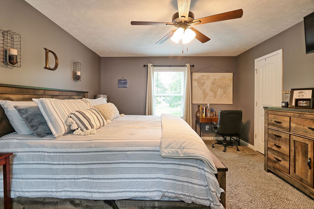 111 Heritage Hills Lane Hohenwald, TN 38462 - Photo 23 of 48 a bedroom with a bed dresser and a window