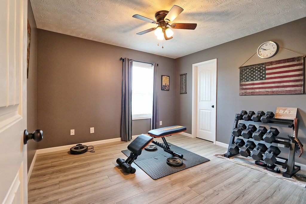 111 Heritage Hills Lane Hohenwald, TN 38462 - Photo 29 of 48 a room with gym equipment and a mirror