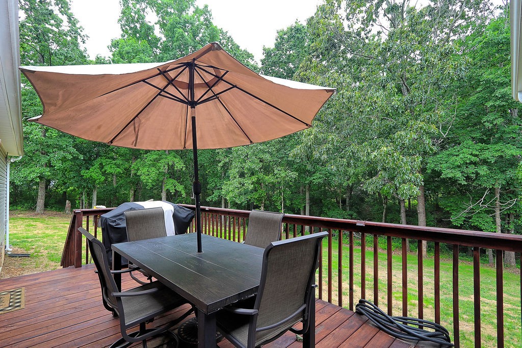 111 Heritage Hills Lane Hohenwald, TN 38462 - Photo 37 of 48 a view of balcony with outdoor seating and wooden floor