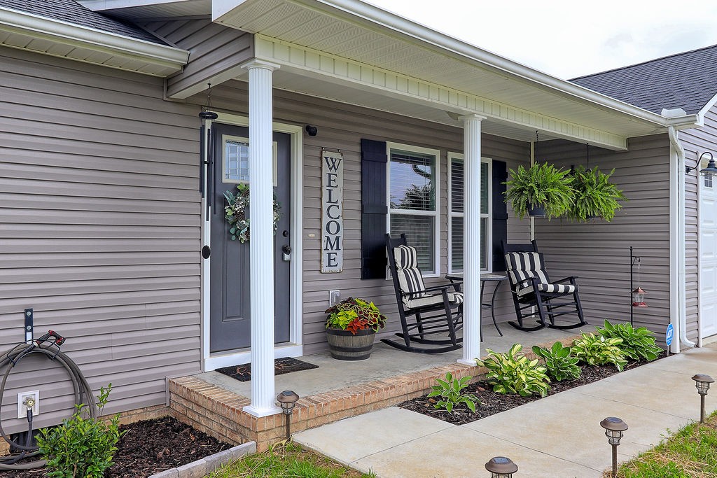111 Heritage Hills Lane Hohenwald, TN 38462 - Photo 4 of 48 a view of a porch with seating space
