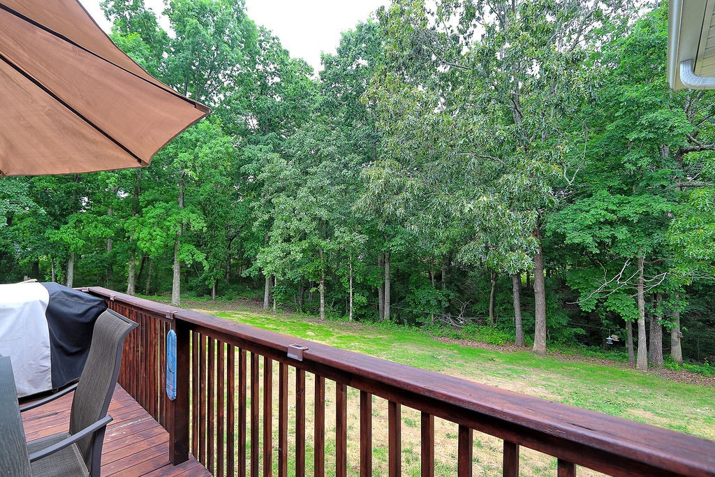 111 Heritage Hills Lane Hohenwald, TN 38462 - Photo 41 of 48 a view of a deck with a backyard