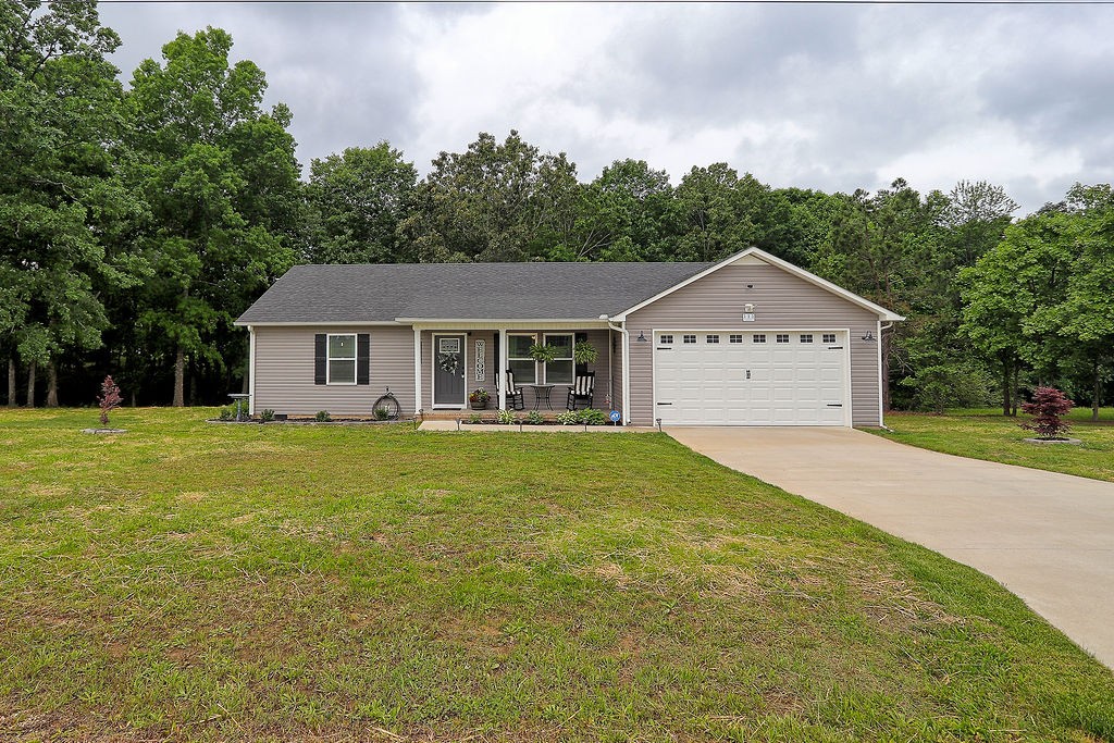 111 Heritage Hills Lane Hohenwald, TN 38462 - Photo 48 of 48 a front view of a house with a yard