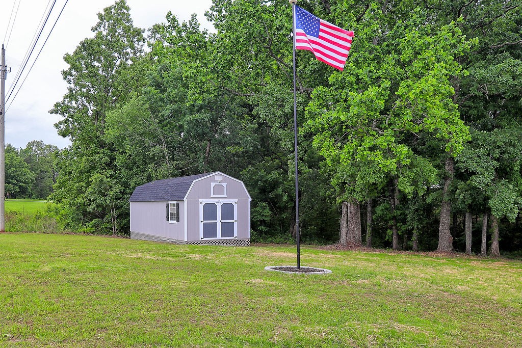 111 Heritage Hills Lane Hohenwald, TN 38462 - Photo 6 of 48 a house view with a outdoor space