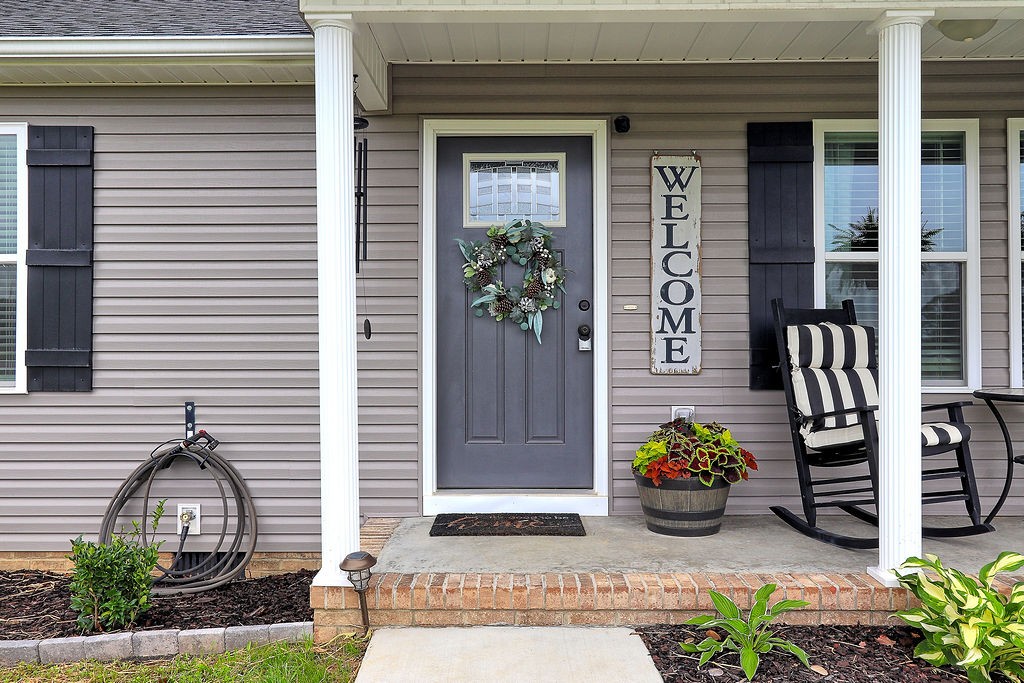 111 Heritage Hills Lane Hohenwald, TN 38462 - Photo 7 of 48 a front view of a house with a garden
