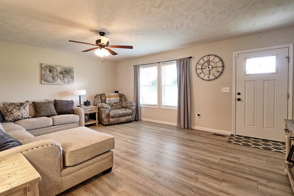 111 Heritage Hills Lane Hohenwald, TN 38462 - Photo 8 of 48 a living room with furniture and a window